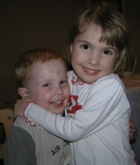 Yvonne's kids - the flower girl Catharina strangling her happy brother Emanuel