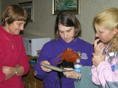 Donna's Mom showing off dubious pictures of Donna's past to Mikelle and Chandra