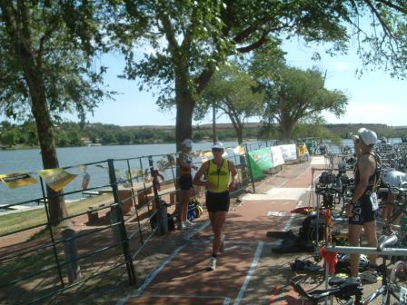 running out of the transition area to start the half marathon
